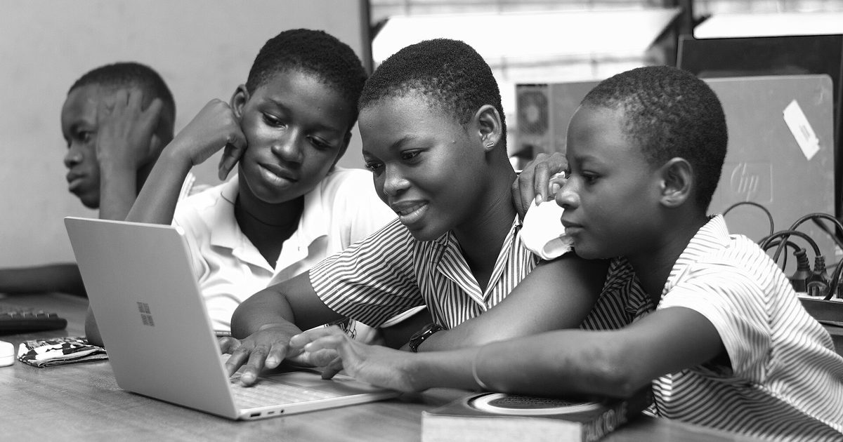 Students learning together on a laptop